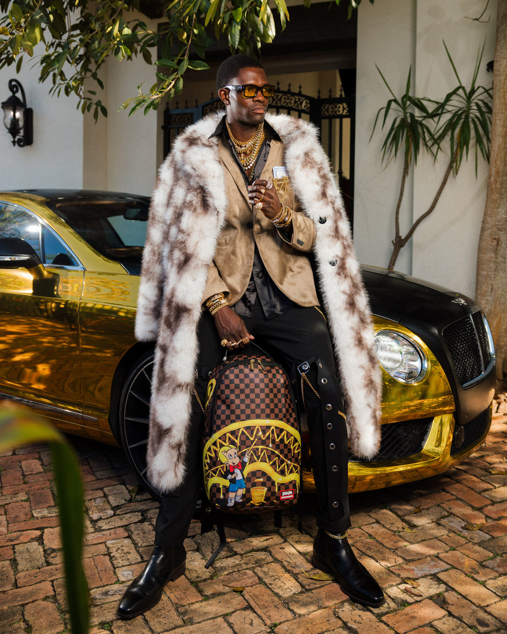 RICHIE RICH PAINT THE SHARK GOLD BACKPACK
